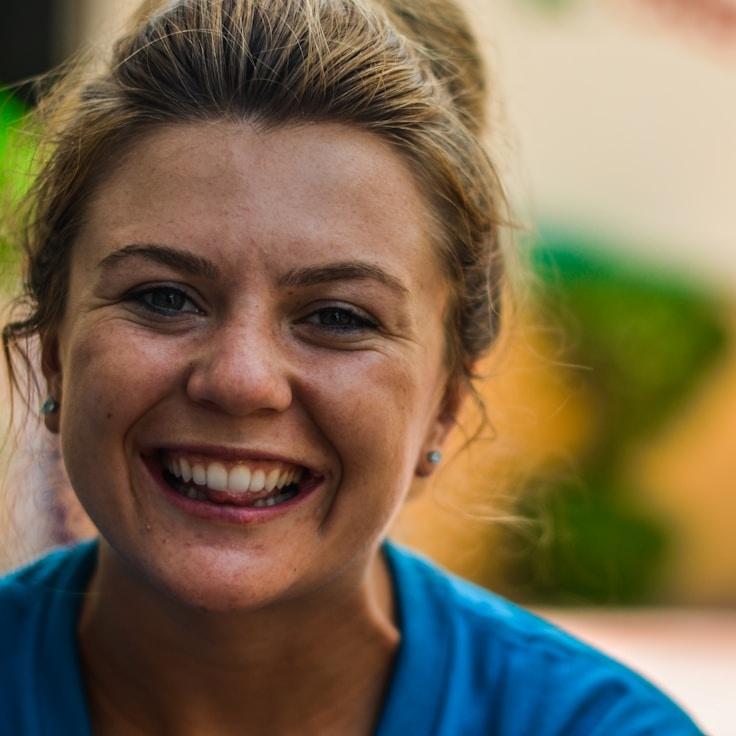 Kaveri Mehta, Lead Design Curator at Cove Level Haven, reviewing corporate floral arrangements